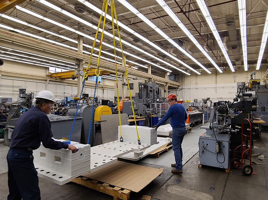 Engineers move heavy components in the manufacturing and assembly facilities.