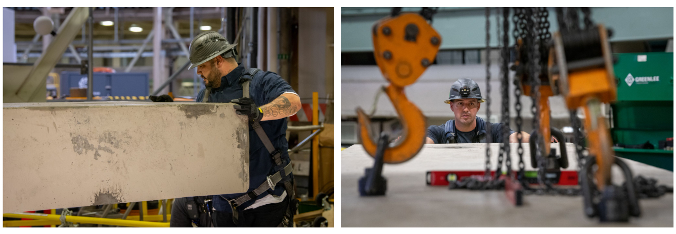 A rigger steers a roof block, while another one looks on to make sure it is level