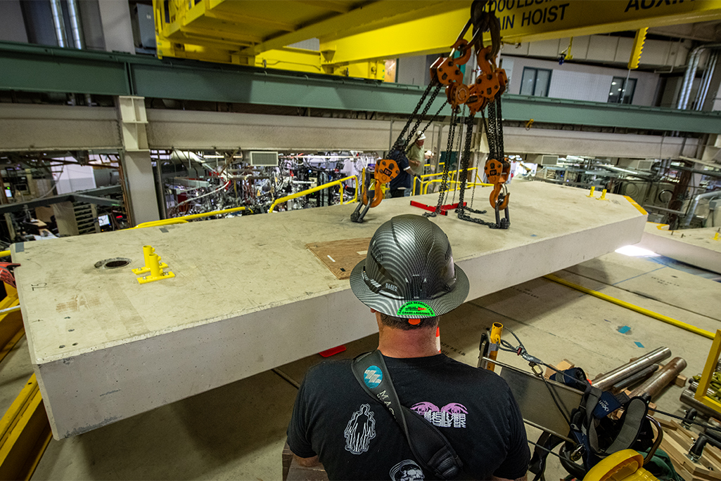 Crane operator maneuvering crane during a lift