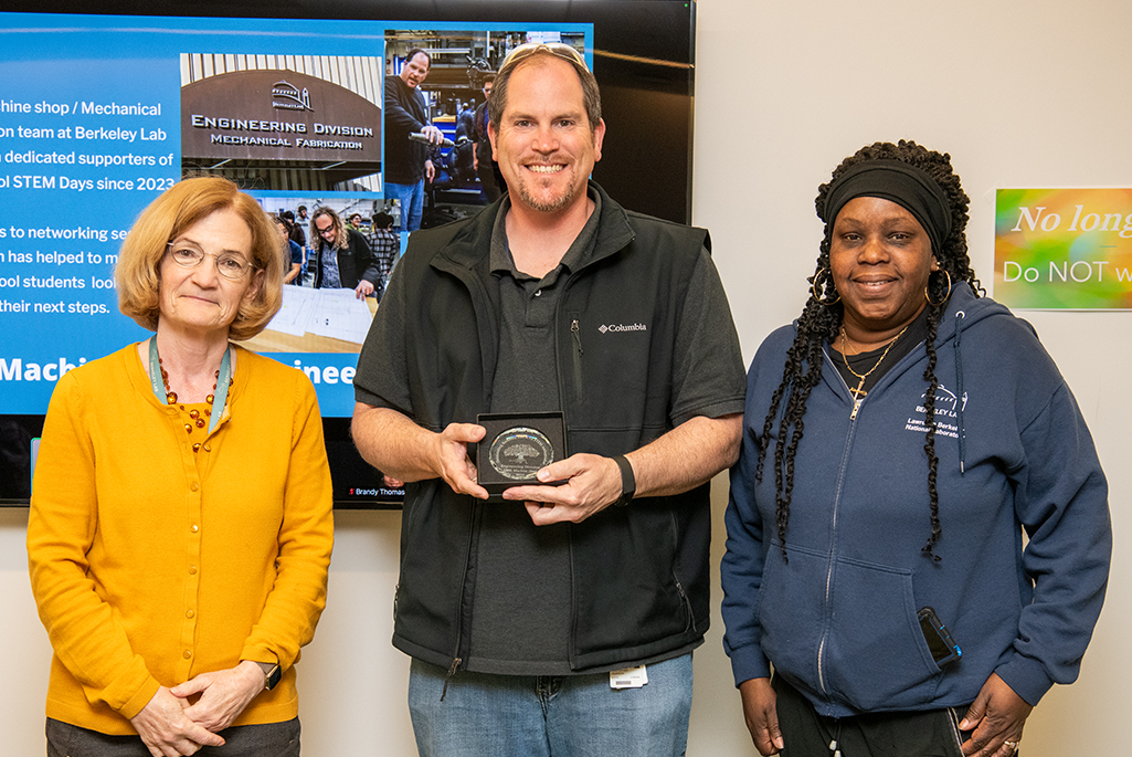 Berkeley Lab Deputy Directory Carol Burns and two Engineering Division volunteers