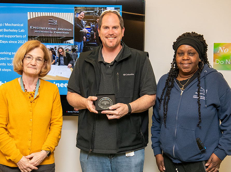 Berkeley Lab Deputy Directory Carol Burns and two Engineering Division volunteers