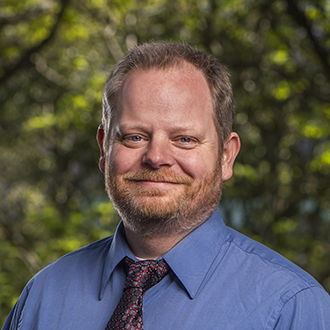 Headshot of Carl Grace.