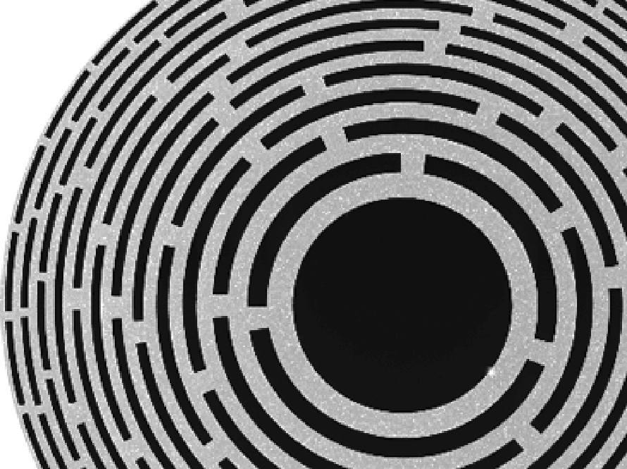 Detailed view of a precision-fabricated circular component with concentric rings radiating from a dark center.