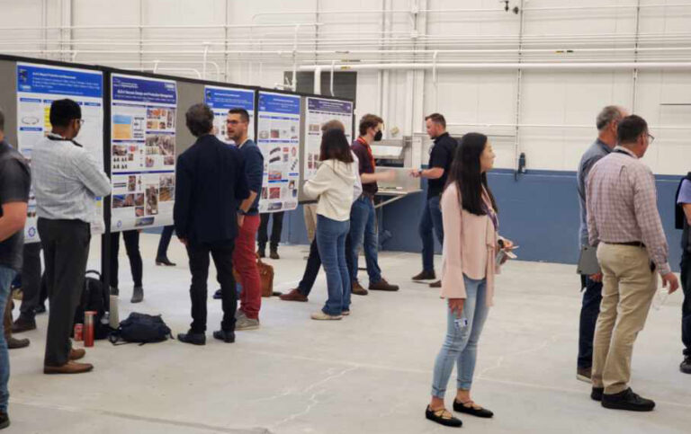 Attendees participating in the poster session