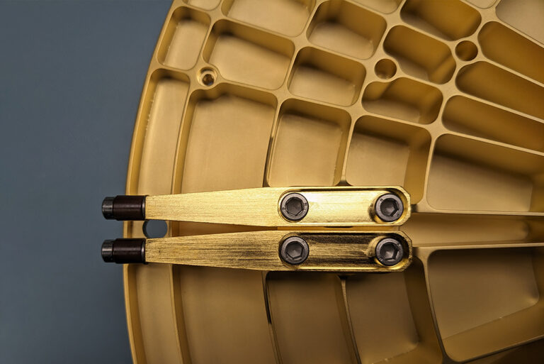 Detailed view of the pin lock assembly on the underside of the carousel