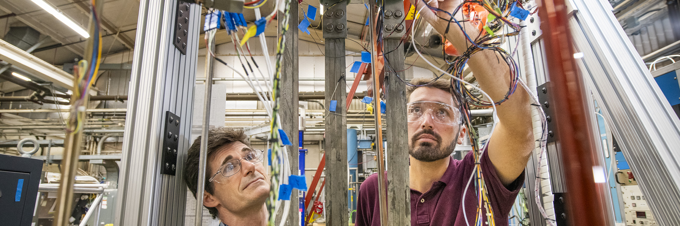 Researchers prepare instrumentation for a hybrid magnet test.