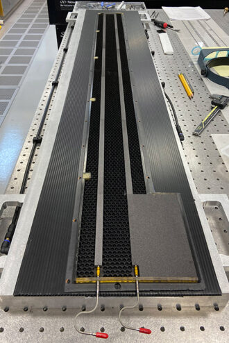 Detector stave core during the lamination process