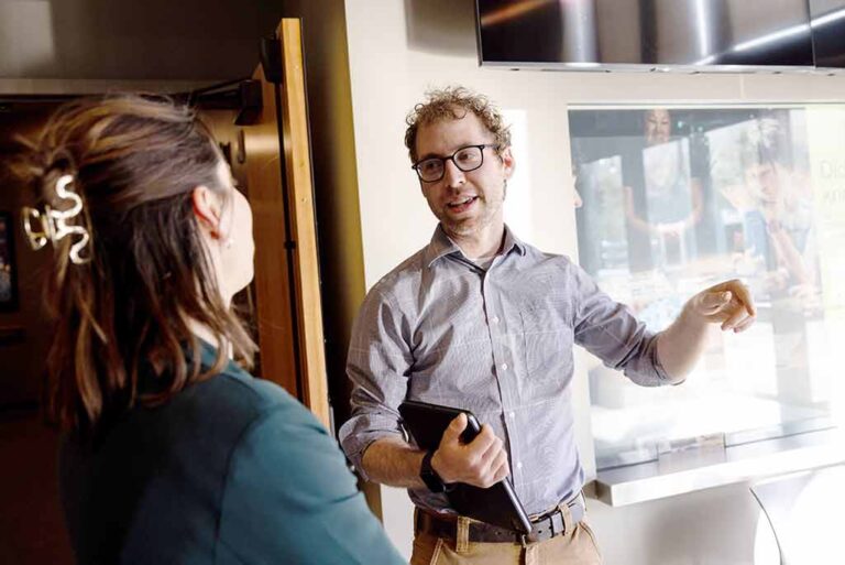 Two staff scientists in discussion