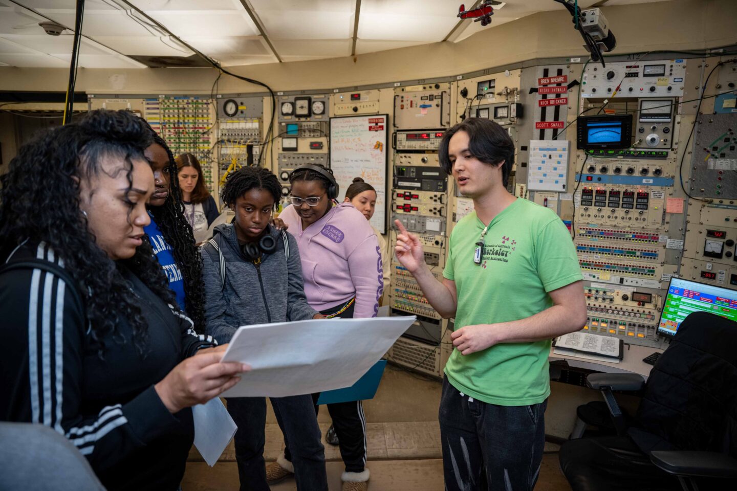 An accelerator operator talks to a group of students about day-to-day operations at the 88 Inch Cyclotron