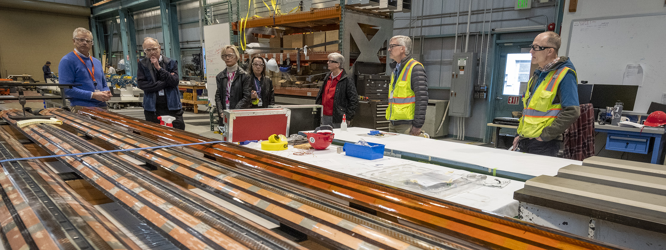 A tour group in engineering facilities in Buildings 77 and 77A.