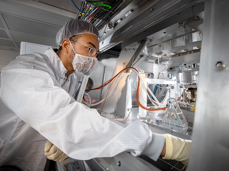 Scientist inspects the vacuum chamber at the CXRO beamline at the Advanced Light Source.