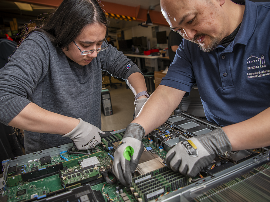 Two techs maintaining a server.