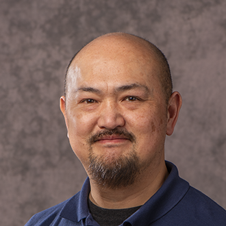 Headshot of Bill Ou.