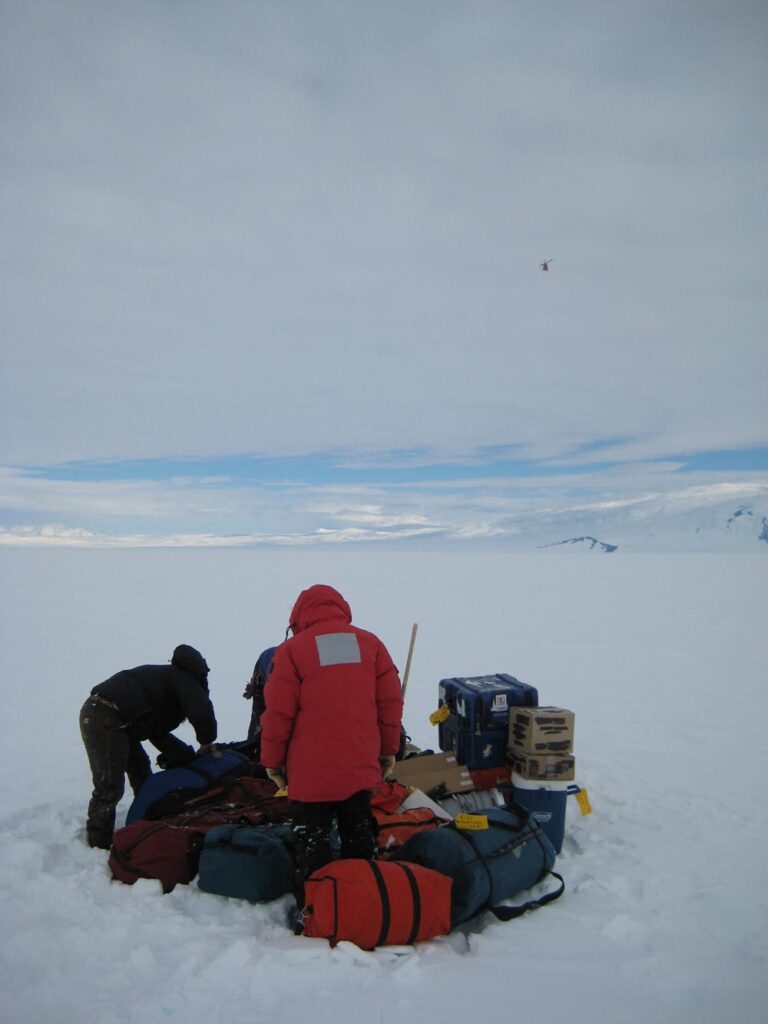 Two researchers with their supplies on the Ross Ice shelf