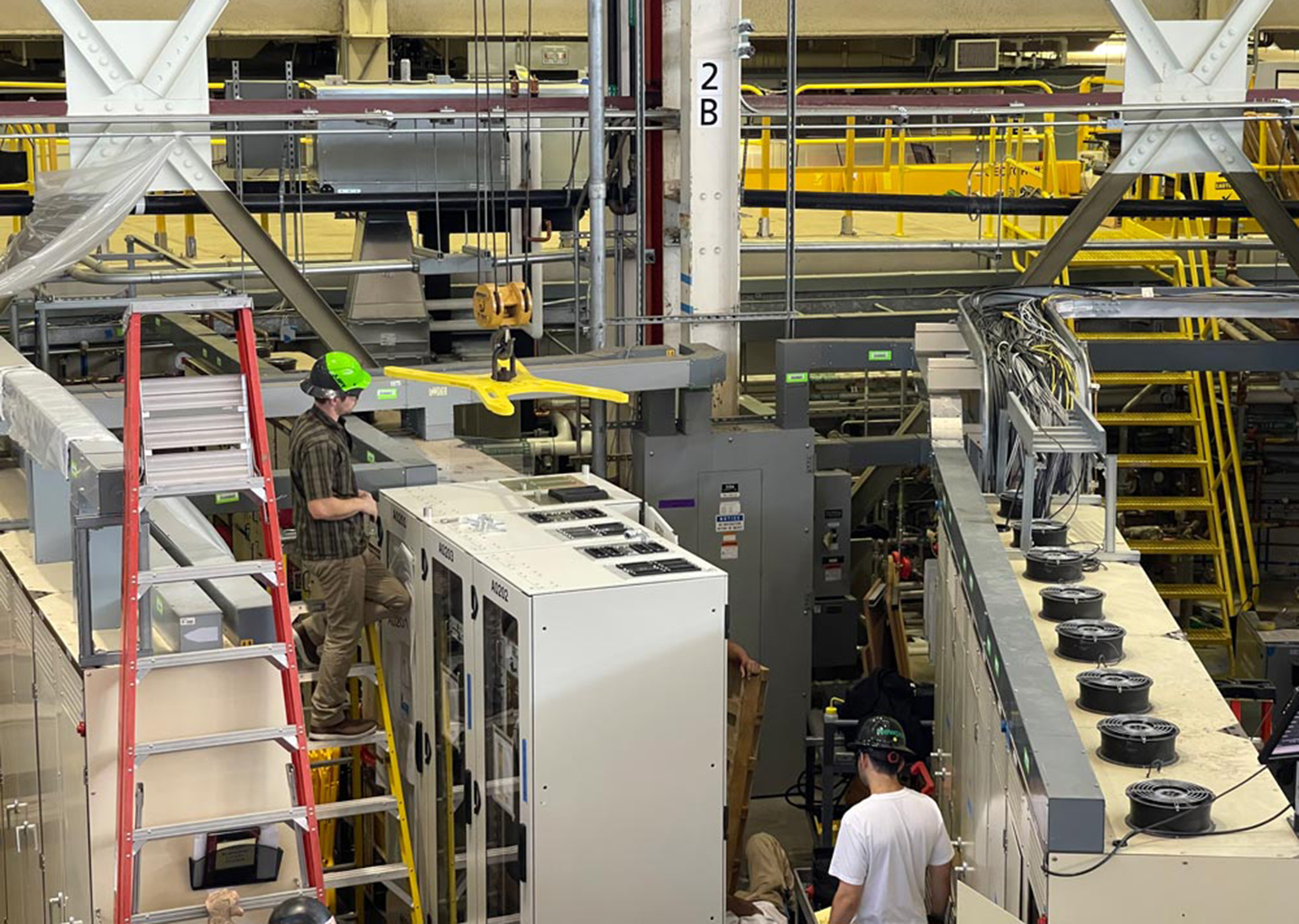 The rack lift fixture being used by workers