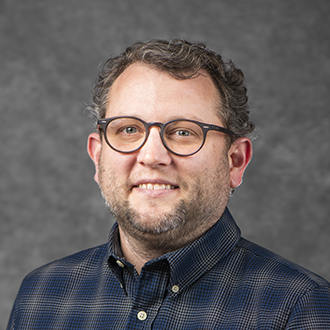Headshot of Andrew Lambert.