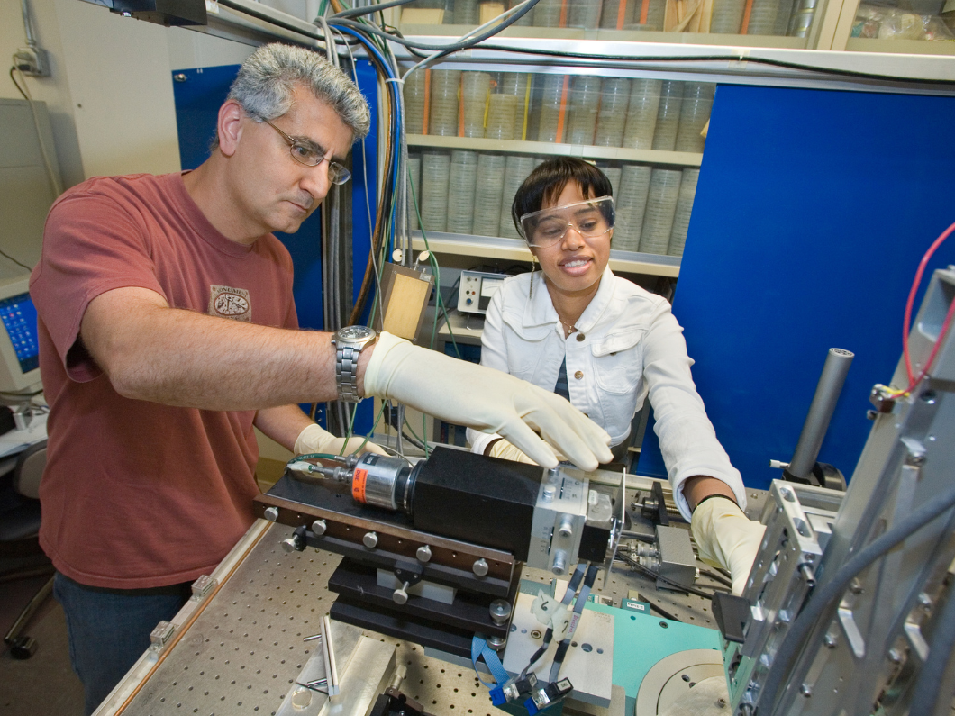Farhad Salmassi pictured with optical equipment at Berkeley Lab.