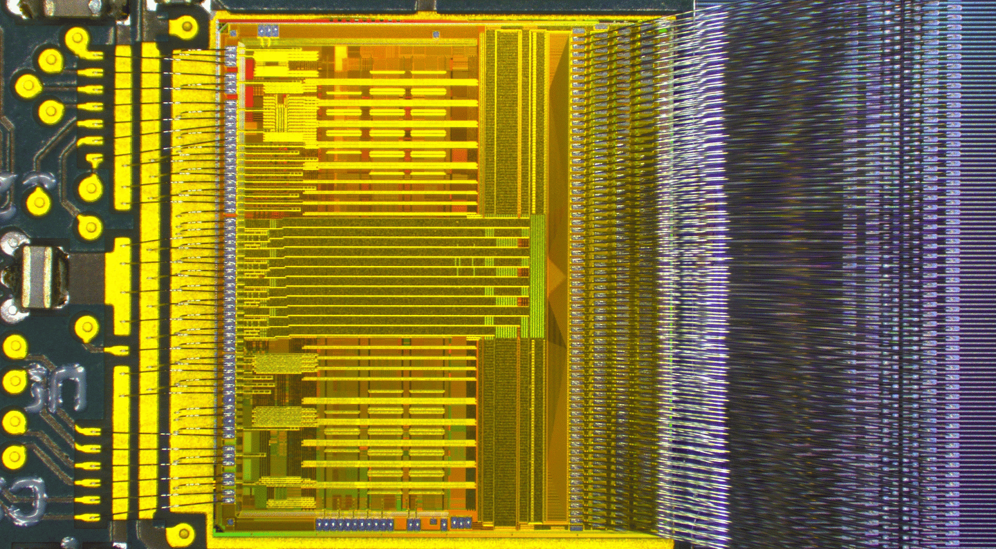 A detailed shot of wire bonding work for an ATLAS chip.