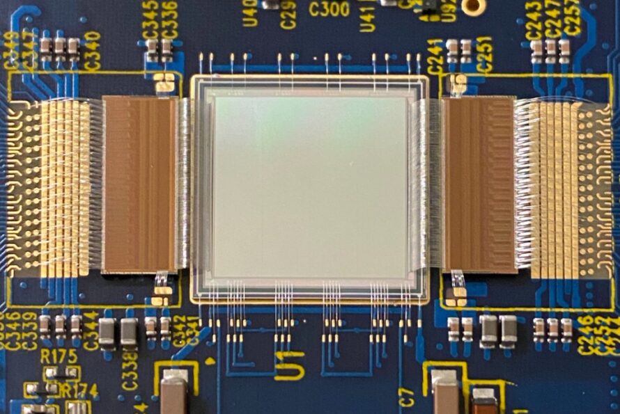 Detailed view of delicate wire bonding work connecting an image sensor and two custom readout chips for the VeryFastCCD project.